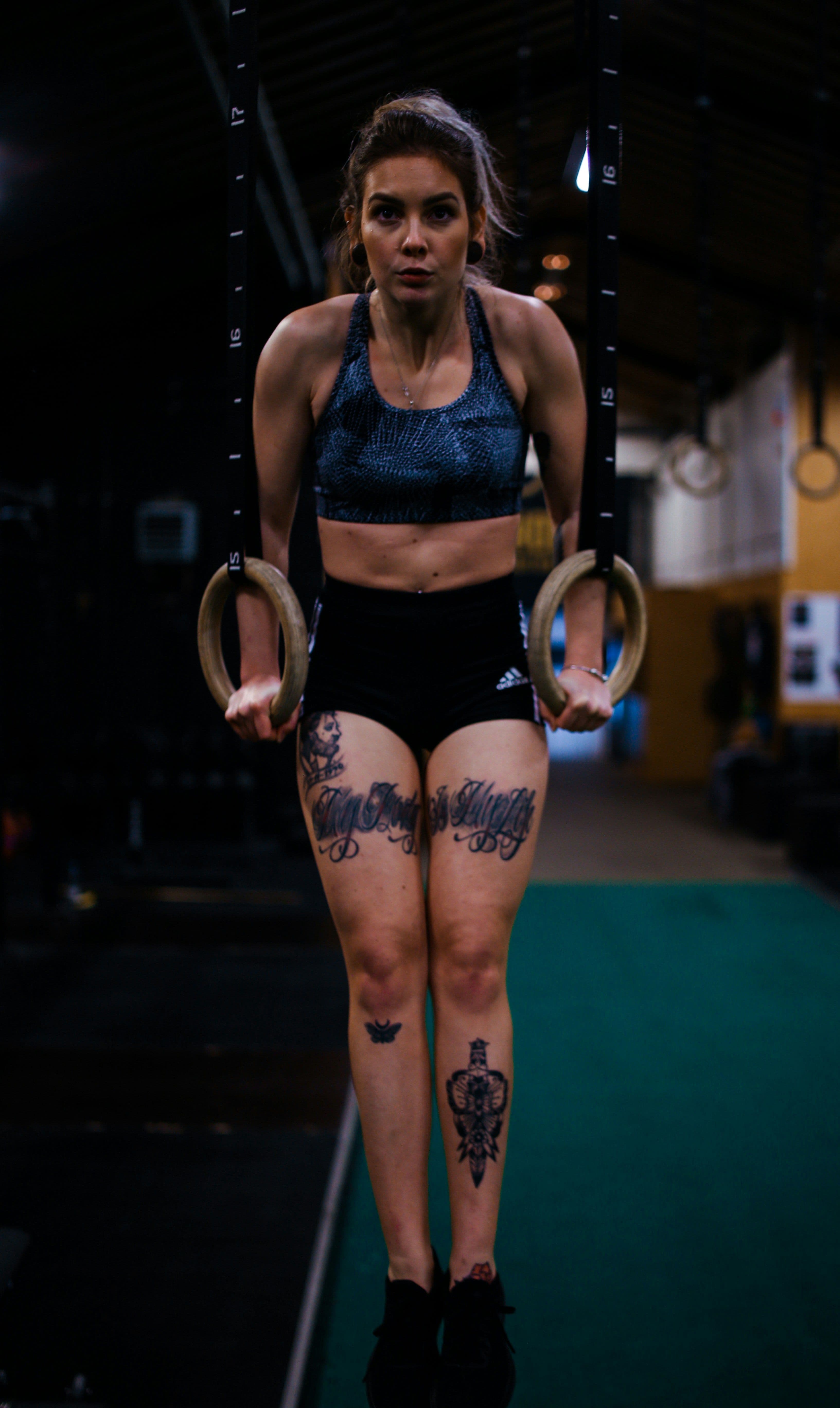 An athlete holding a controlled position on the rings